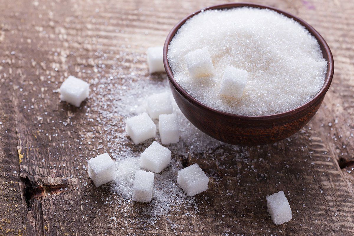 Brown and white sugar side by side